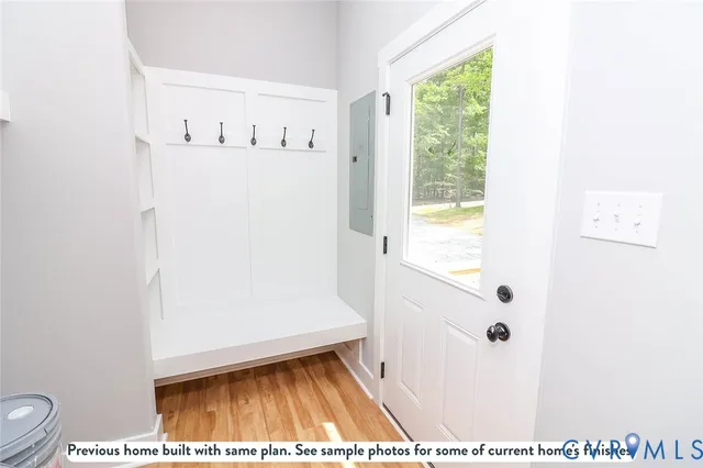 a view of bathroom with a window and a white wall