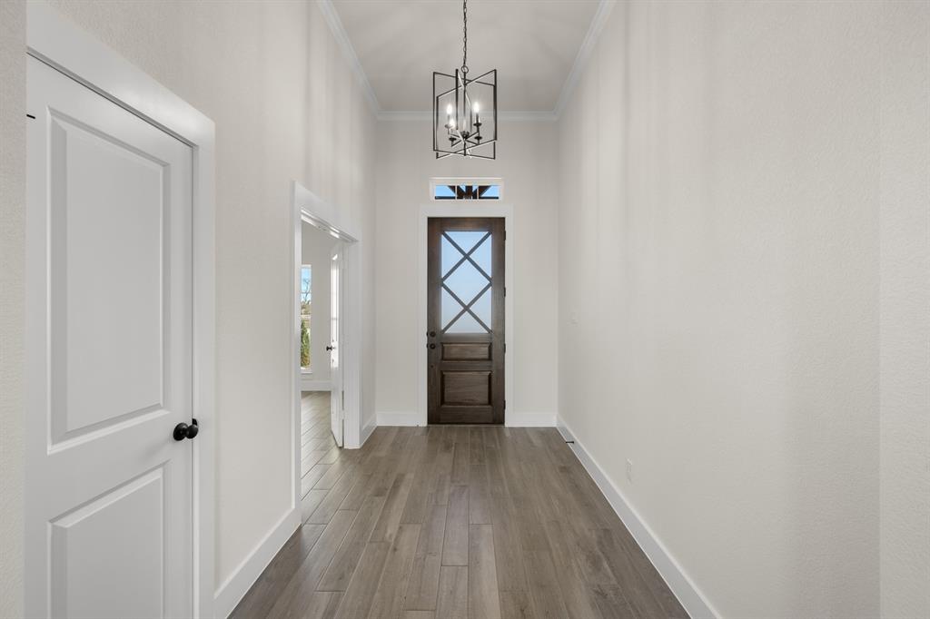 4867 Prairie Sky Lane DISH, TX 76247 - Photo 6 of 27 a view of a hallway view with wooden floor and entryway