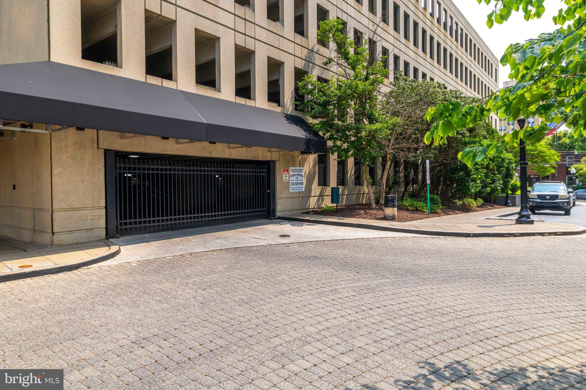2001 Hamilton Street, Unit 1119 Philadelphia, PA 19130 - Photo 43 of 44 Urban entrance with lush greenery.
