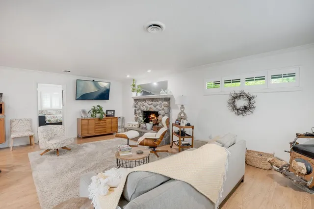 a kitchen with stainless steel appliances granite countertop a sink and a refrigerator