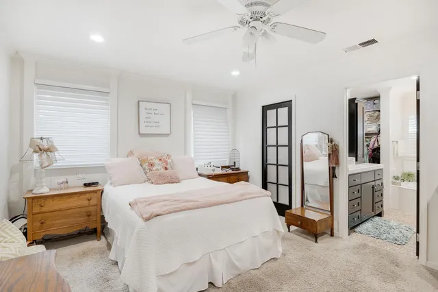 a bedroom with bed and a dresser