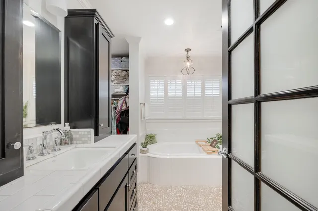 a bathroom with a double vanity sink a and a shower