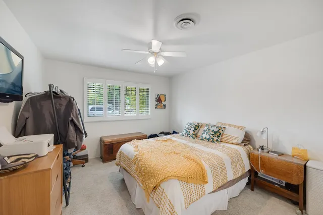 a front view of a house with yard patio and fire pit