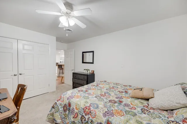 a view of backyard with a table and chairs and a fire pit