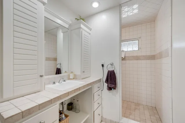 a view of a house with a yard and tree s