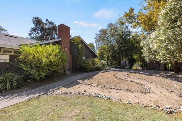 a view of a car parked in front of a house