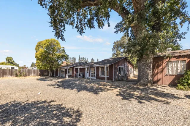 an aerial view of house with yard