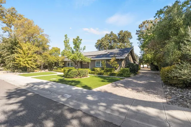 a view of a swimming pool with an outdoor space and seating area