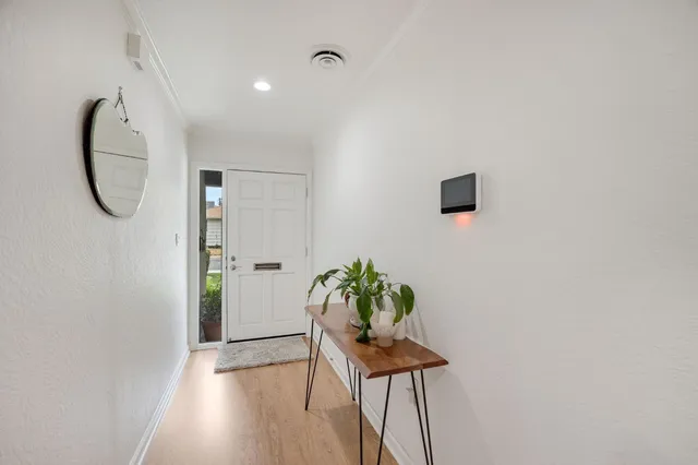 a kitchen with stainless steel appliances kitchen island granite countertop a refrigerator and microwave