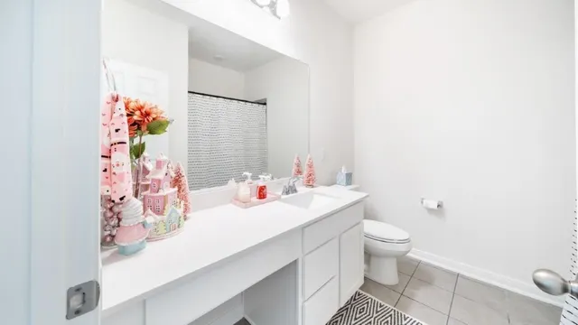 a bed room with a bed mirror and a window