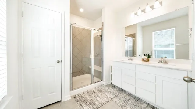 a view of walk in closet with clothes