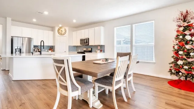 an aerial view of a house with a swimming pool