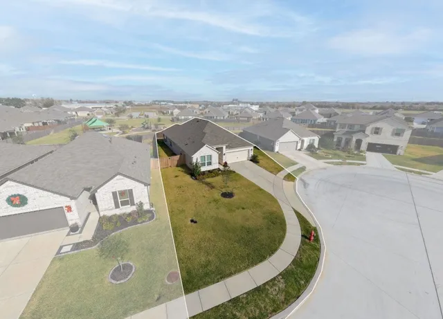 an aerial view of a highlighted house