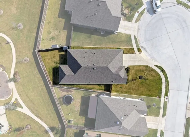 an aerial view of a house with swimming pool