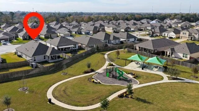 a kitchen with stainless steel appliances granite countertop white cabinets and a stove with wooden floor