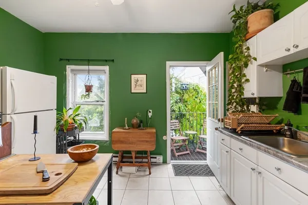 a view of a chairs and table in a balcony