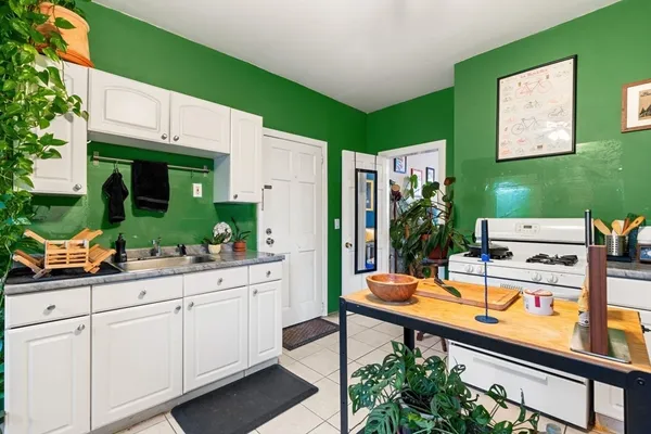 a view of a kitchen and utility room