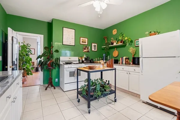 a kitchen with a refrigerator and countertop