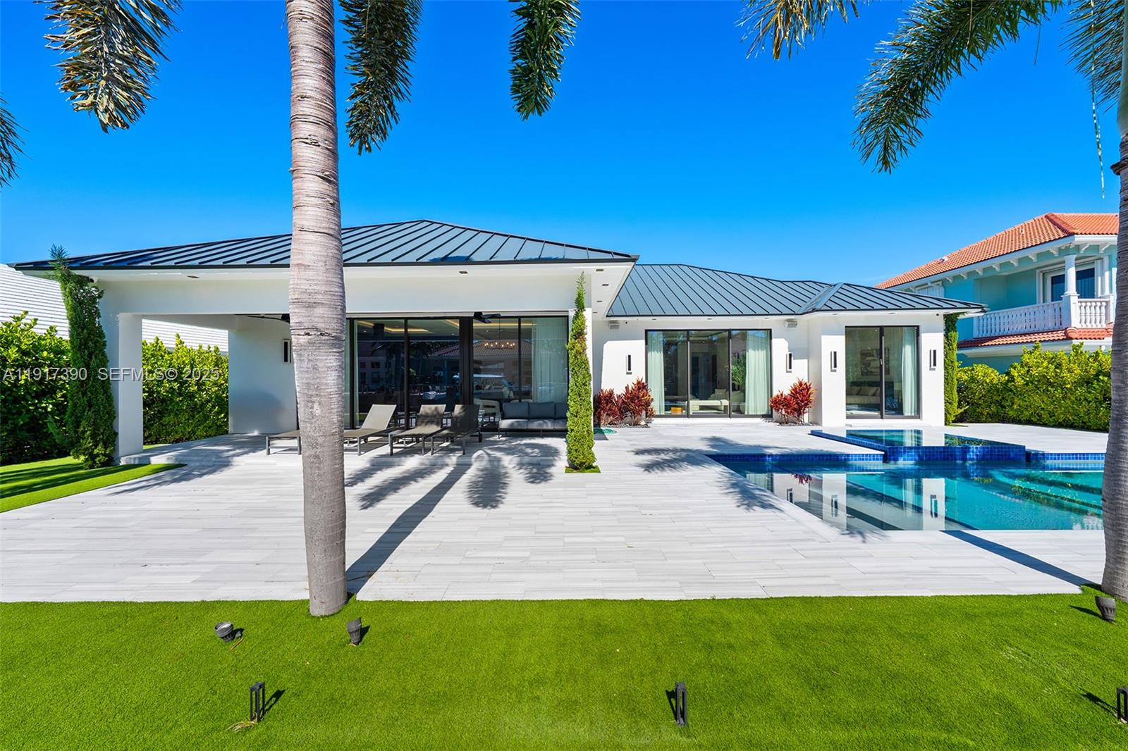 900 Washington Street Hollywood, FL 33019 - Photo 49 of 61 a view of a house with backyard porch and sitting area
