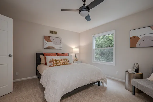 a bedroom with a bed and furniture