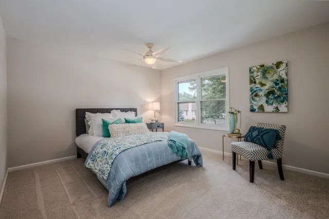 a bedroom with a bed and a couch