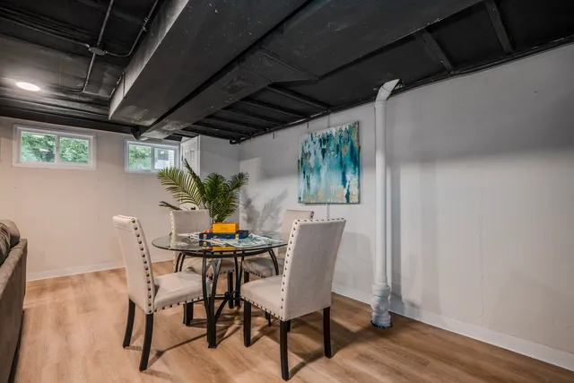 a dining room with furniture and window