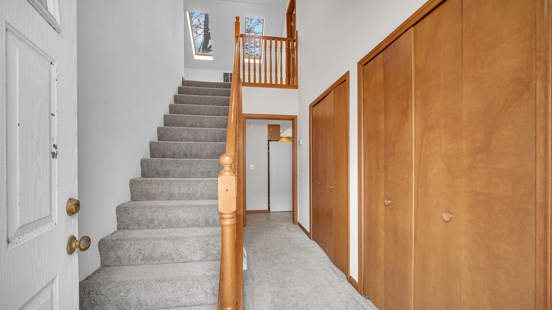 4472 South County Road 210 Knox, IN 46534 - Photo 21 of 30 a view of staircase with white walls and windows