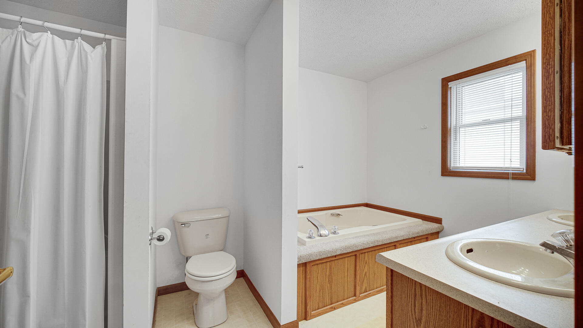 4472 South County Road 210 Knox, IN 46534 - Photo 23 of 30 a view of a bathroom with a sink toilet and window