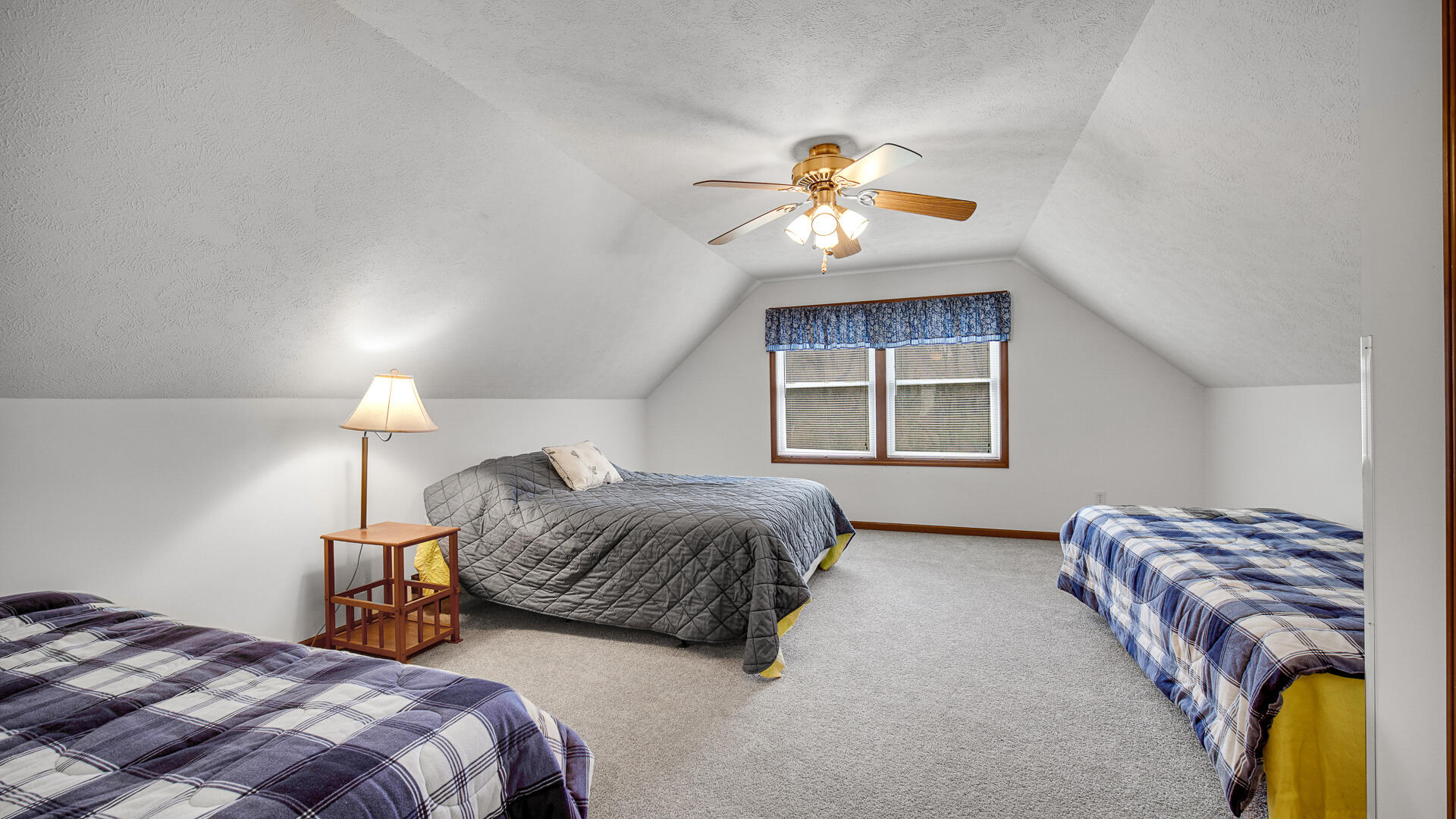 4472 South County Road 210 Knox, IN 46534 - Photo 25 of 30 a bedroom with bed and a window