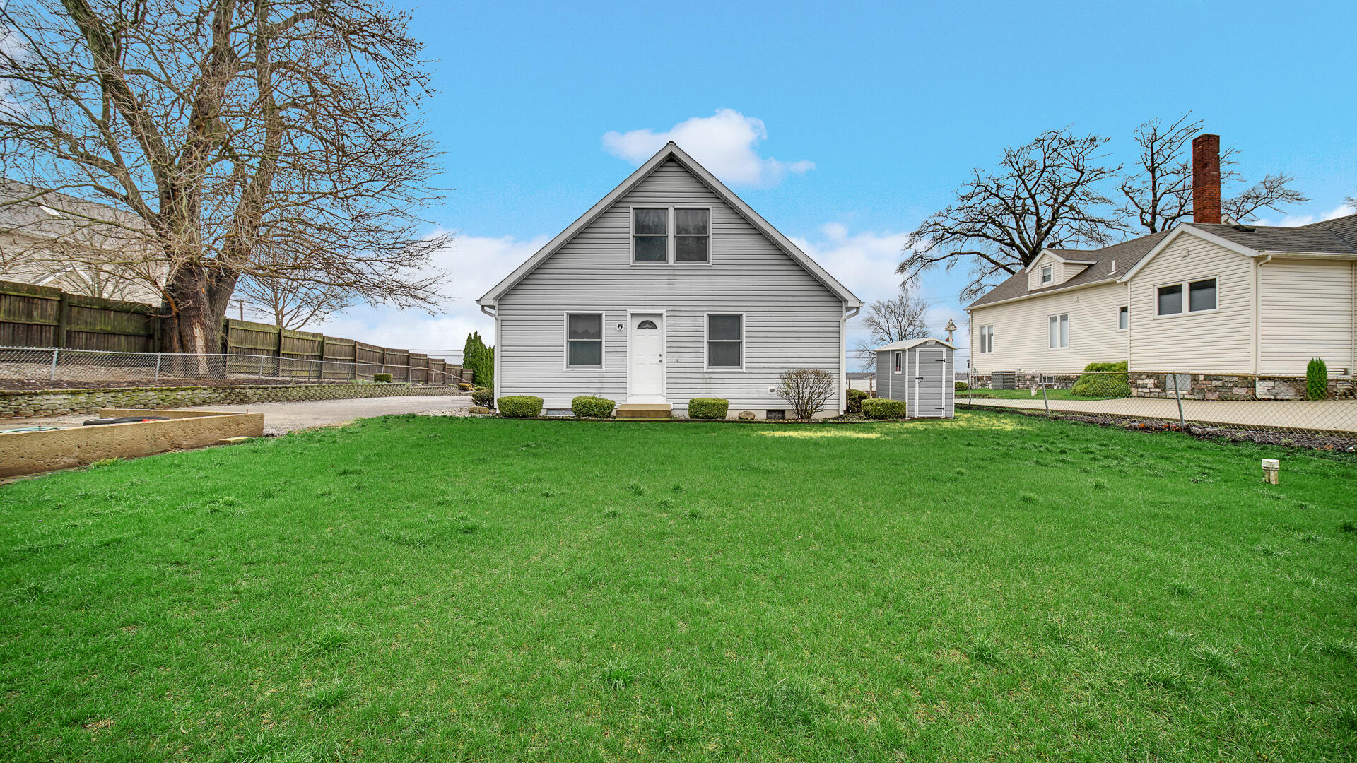 4472 South County Road 210 Knox, IN 46534 - Photo 5 of 30 a front view of a house with a garden and yard