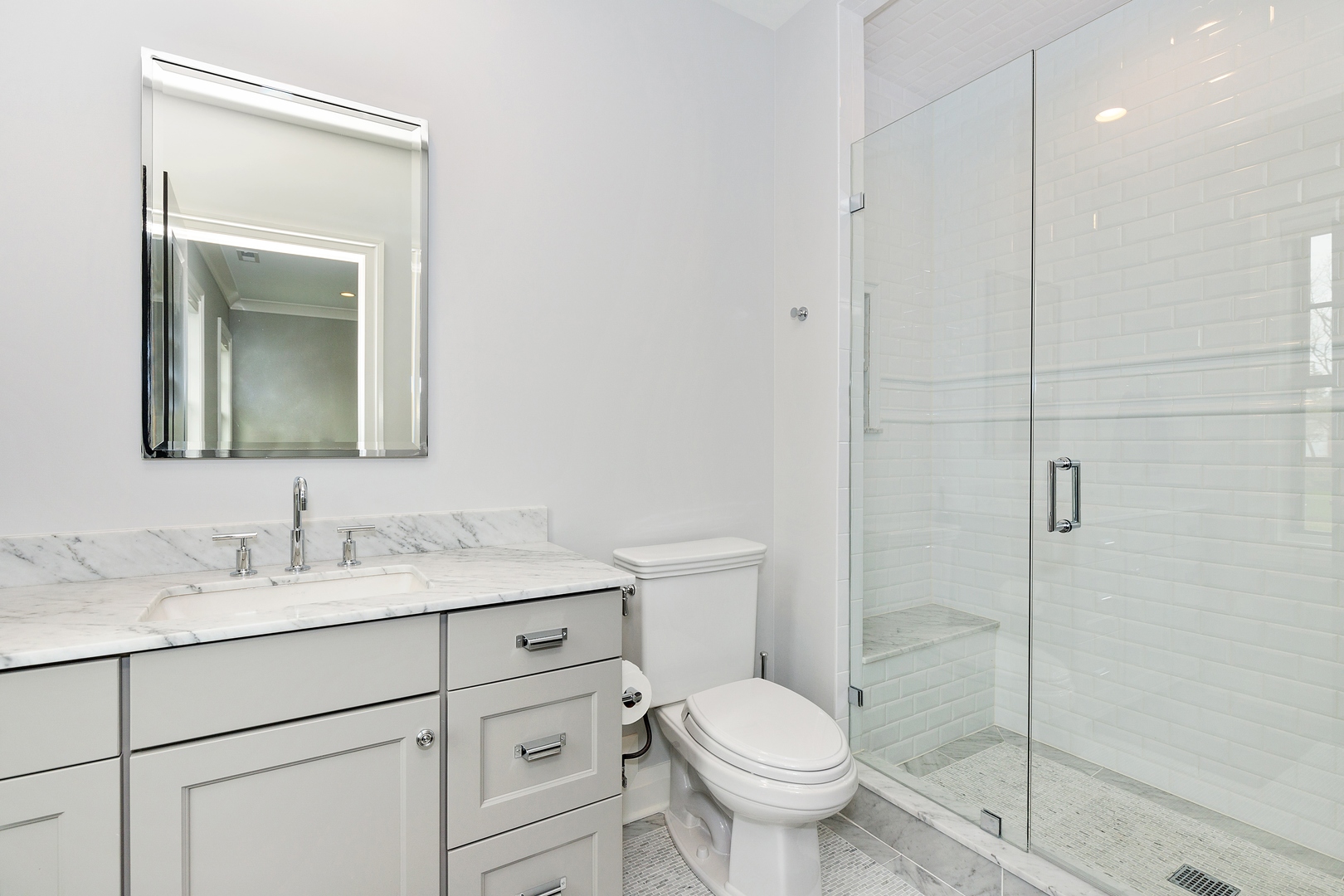 152 North Ridge Road Lake Forest, IL 60045 - Photo 22 of 23 a bathroom with a toilet sink vanity and mirror