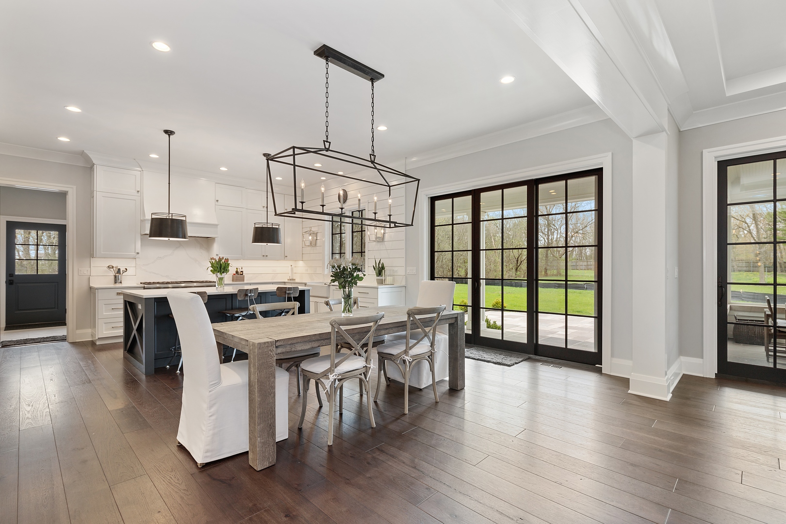 152 North Ridge Road Lake Forest, IL 60045 - Photo 5 of 23 a open dining room with stainless steel appliances granite countertop furniture wooden floor and a kitchen view