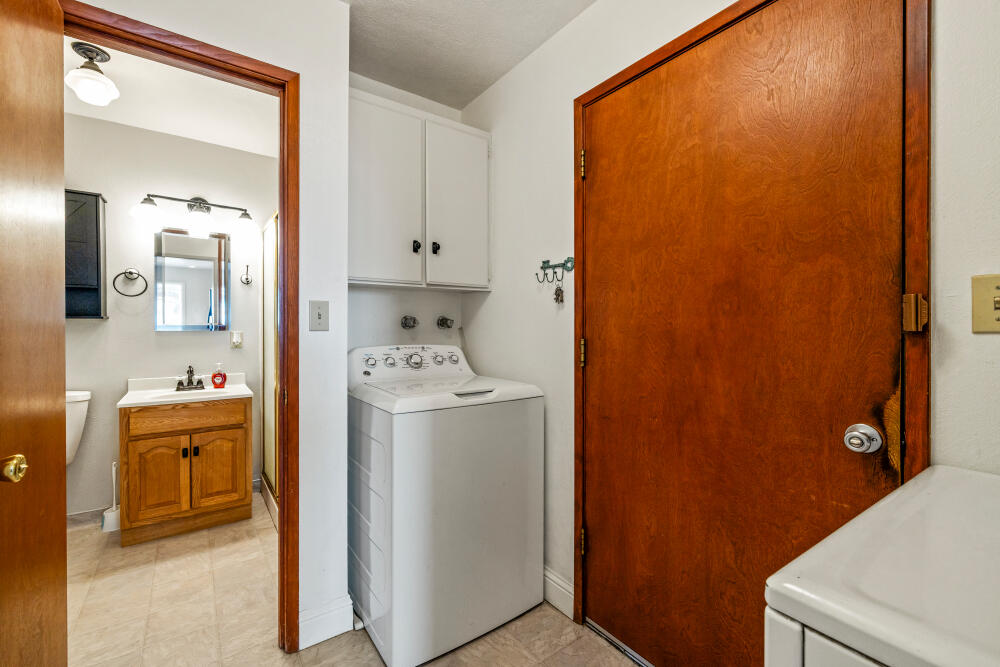 23131 North Poe Valley Road Klamath Falls, OR 97603 - Photo 20 of 45 a view of bathroom with a sink washer and dryer