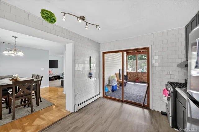 a view of a livingroom with furniture and wooden floor