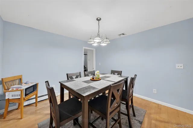 a view of a dining table and chairs in the room