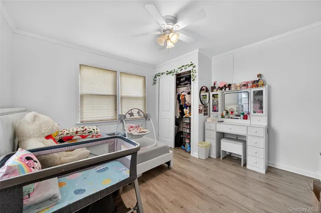 a bedroom with furniture and a window