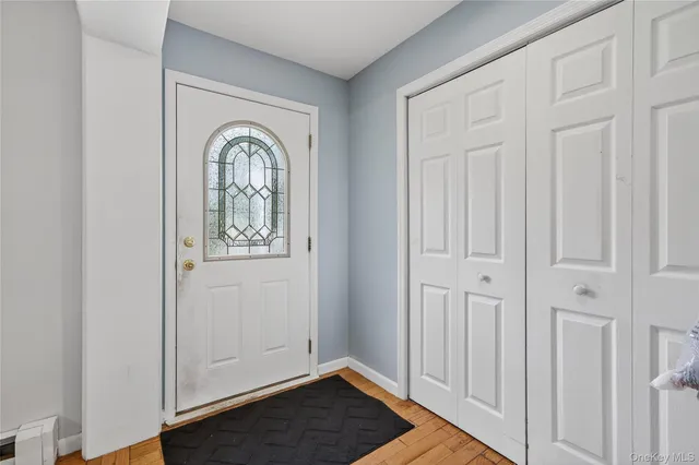 a view of front door with wooden floor