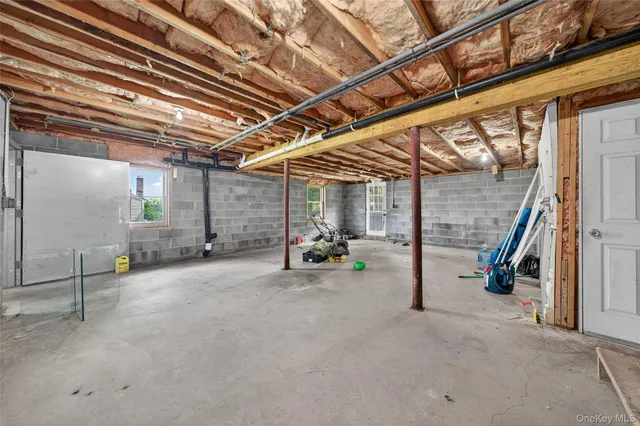 a view of empty room with wooden ceiling