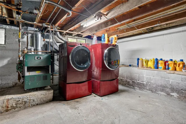 a view of a patio with a table and chairs and a barbeque