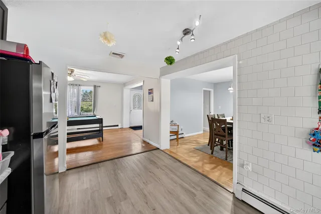 a view of a livingroom with furniture and a ceiling fan