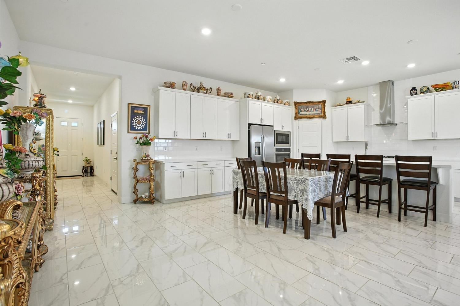 3742 Haymaker Way Sacramento, CA 95835 - Photo 11 of 39 a view of kitchen with refrigerator and chairs