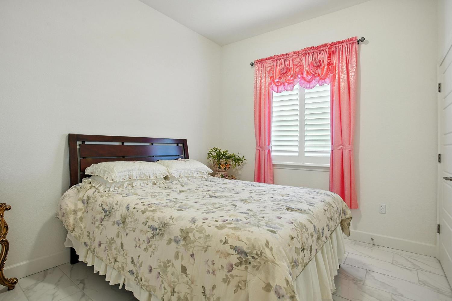 3742 Haymaker Way Sacramento, CA 95835 - Photo 15 of 39 a bedroom with a bed and a window