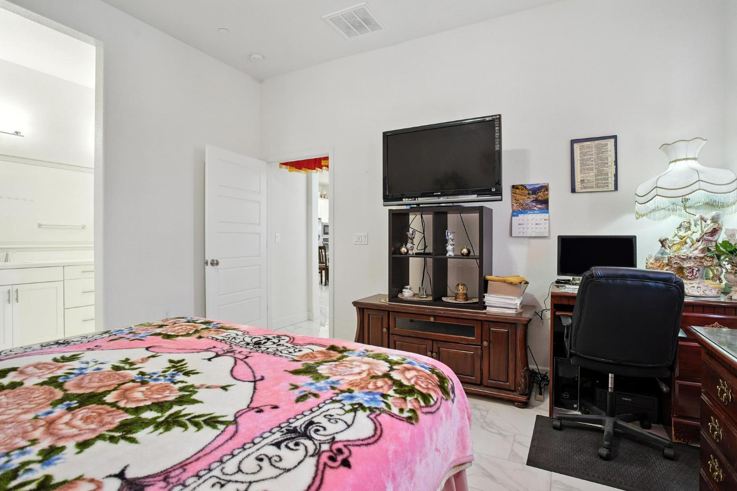 3742 Haymaker Way Sacramento, CA 95835 - Photo 23 of 39 a bedroom with a bed and a flat screen tv