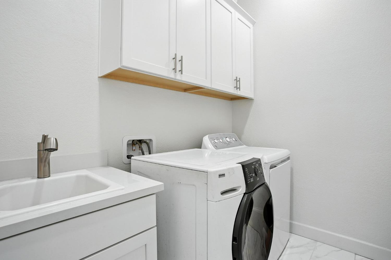 3742 Haymaker Way Sacramento, CA 95835 - Photo 29 of 39 a utility room with dryer and washer