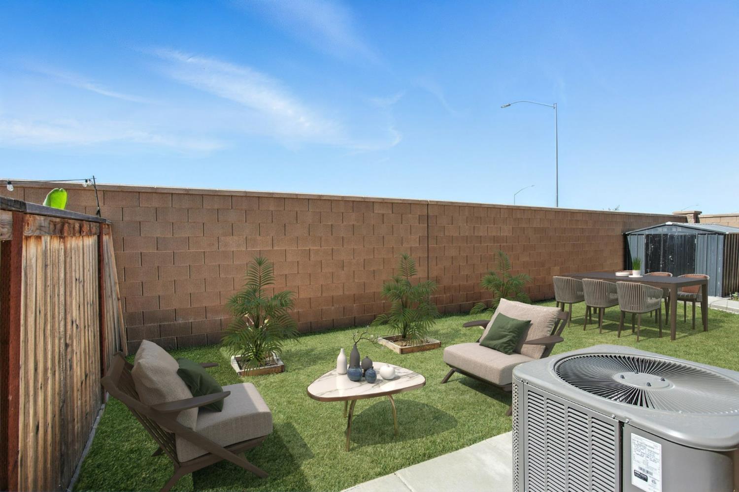 3742 Haymaker Way Sacramento, CA 95835 - Photo 38 of 39 a backyard of a house with fireplace table and chairs