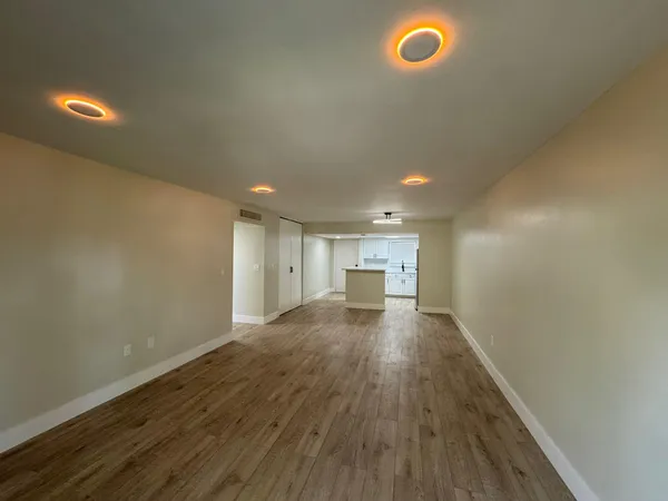 a view of a livingroom with wooden floor