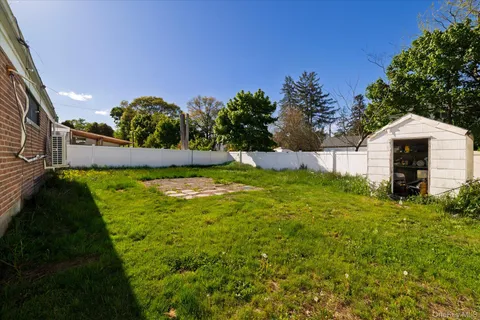 a backyard of a house with lots of green space