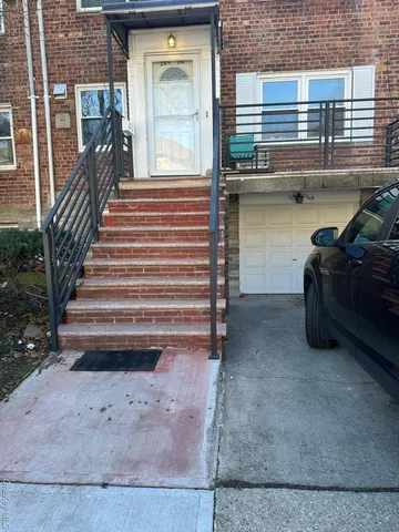 a view of a hardwood floor and a window in the back yard