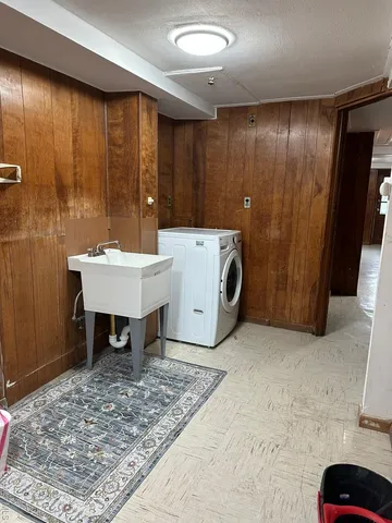 a view of a hallway with washer and dryer