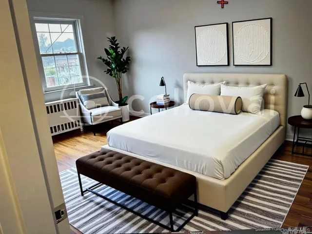 a bedroom with bed and window